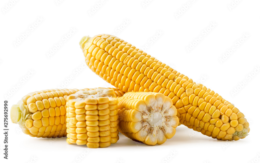Ripe corn and pieces on a white background. Isolated - obrazy, fototapety, plakaty 