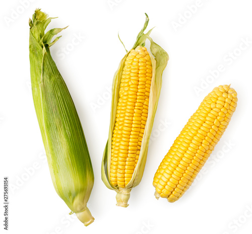 Corn cob in leaves and peeled on a white. The view of the top.