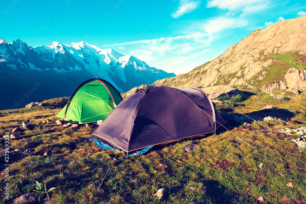 Two tents in the mountains in the Alps, Europe (still life coach, company, friendship, background - concept)