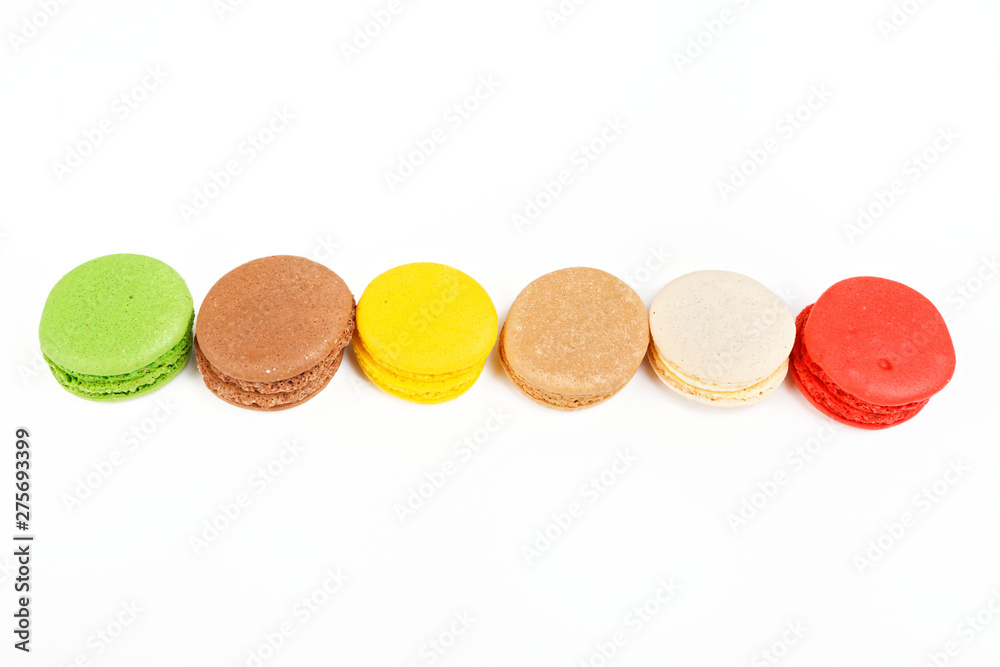 Macaroons on a white background. A row of colored macaroons. Macaroons on a white background. A row of colored macaroons.