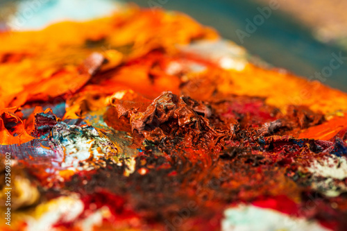 Background image of bright oil-paint palette closeup.