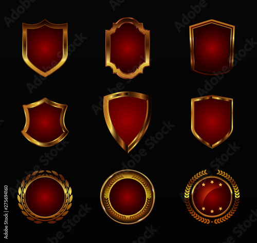 Gold shield shape icons set. 3D golden emblem signs isolated on black background. Symbol of security, power, protection. Badge shape shield graphic design illustration eps10