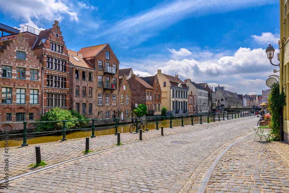 View of embankment of Leie river in the historic city center in Ghent (Gent), Belgium. Architecture and landmark of Ghent. Cityscape of Ghent.