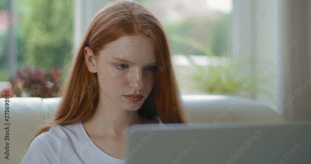 Serious girl working on a laptop. tracking shot. in slow motion. Shot on Canon 1DX mark2 4K camera