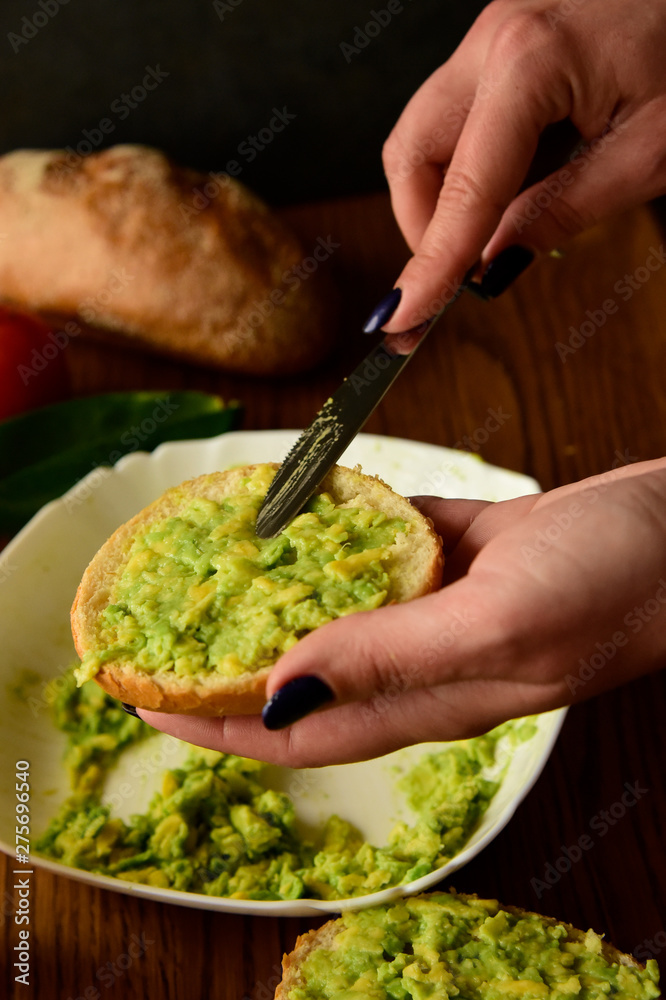 Making avocado toast on the home kitchen Making avocado toast on the home kitchen
