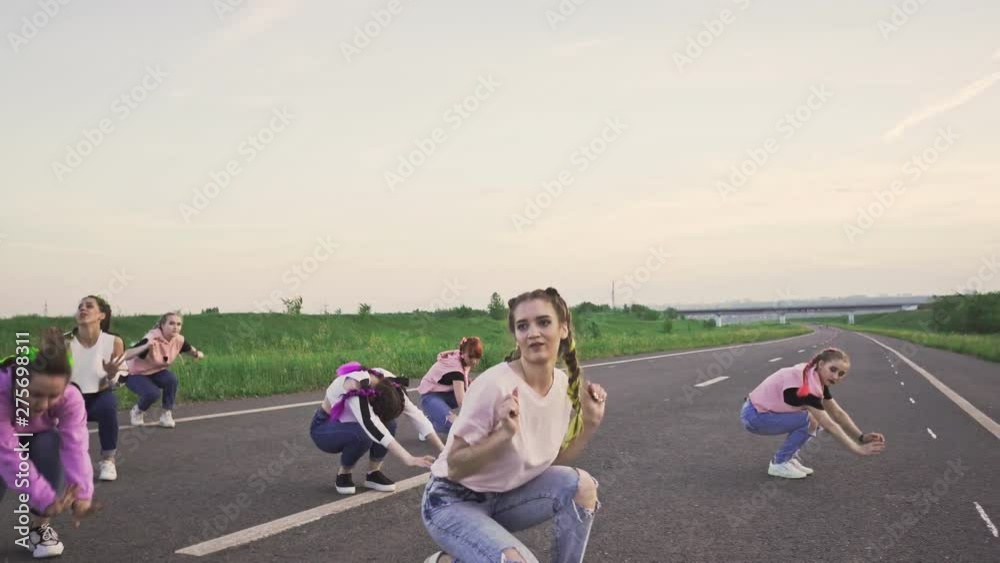 Group dancing hip-hop on road Group dancing hip-hop on road