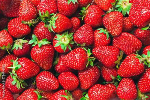 a lot of ripe juicy strawberries - background
