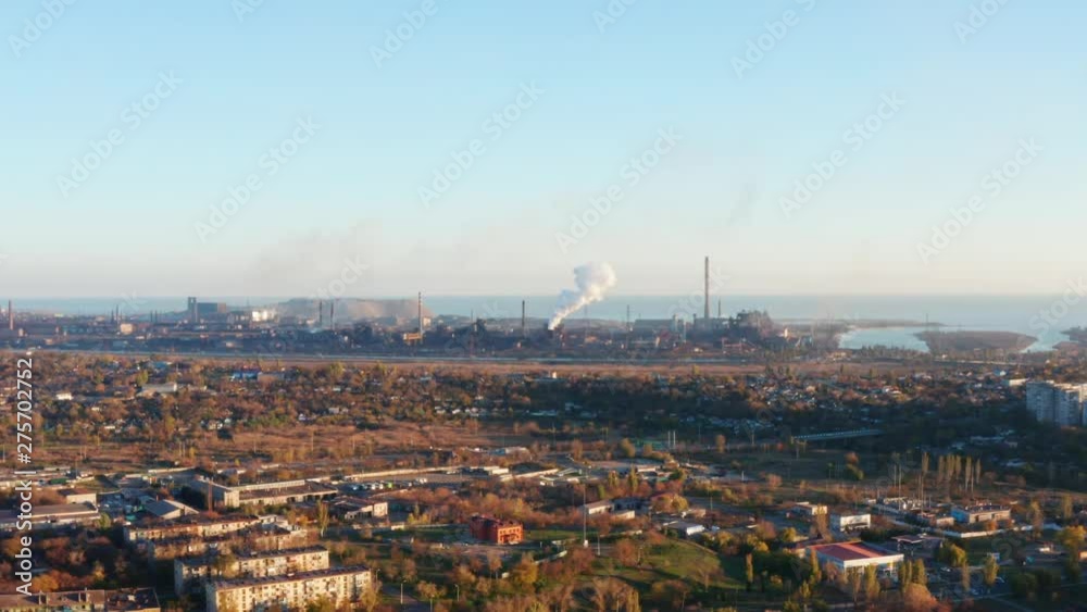 Steel plant on the banks of the river and the sea. Aerial view. Smog in the city. Environmental pollution Steel plant on the banks of the river and the sea. Aerial view. Smog in the city. Environmental pollution