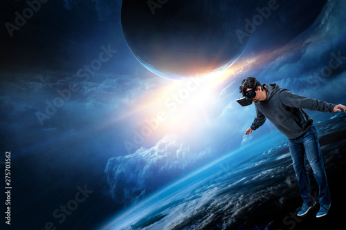 Virtual reality experience, young man in VR glasses