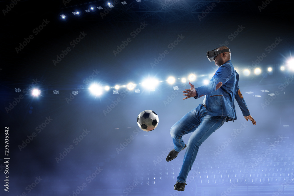 Virtual Reality headset on a black male playing soccer. Mixed media