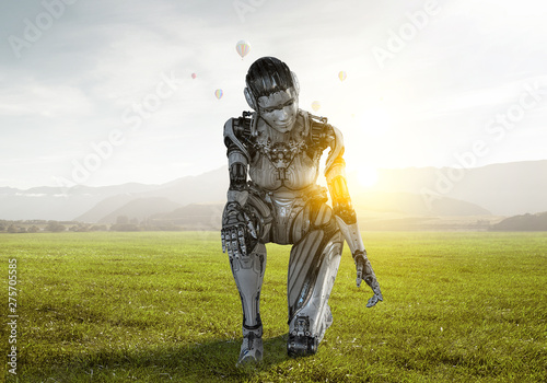 Cyborg silver woman sitting on one knee and smiling