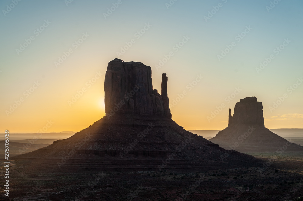 Early morning sunrise over the famous merrick en mittens butte at monument valley, Az.