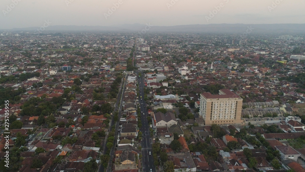 Obraz premium aerial view yogyakarta city cultural capital indonesia located on java island. Yogyakarta with buildings, highway at sunset time. aerial view