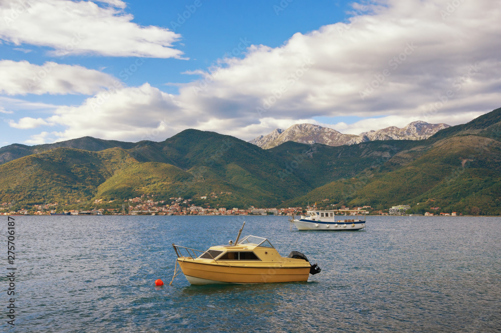 Beautiful  autumn Mediterranean landscape  - mountains, sea and fishing boats on the water.  Montenegro, Adriatic Sea, Bay of Kotor