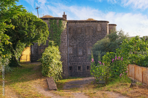 Old fort on sunny summer day. Montenegro, ancient Austro-Hungarian fortress in Tivat city, Donja Lastva photo