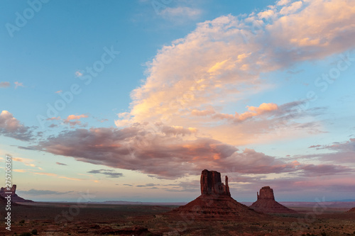 The famous Merrick and Mittens Buttes from monument valley basking in the Light of the setting sun.