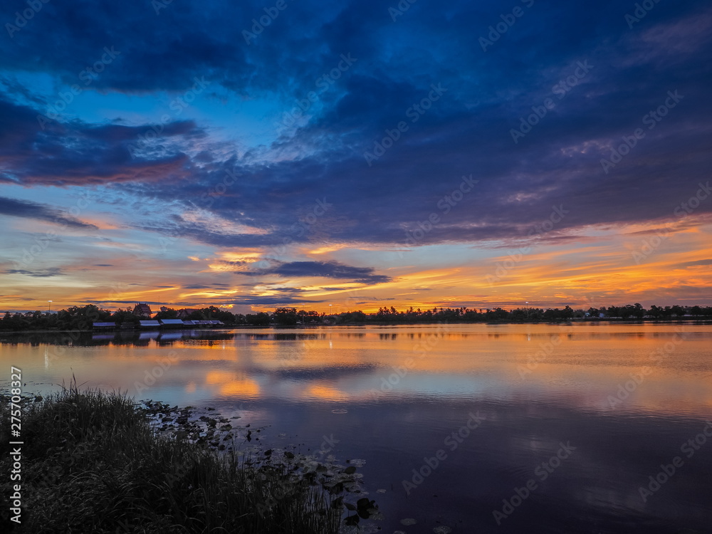 Fototapeta premium Lake view morning scenic above lotus lake with cloudy sky background, sunrise at Krajub Reservoir, Ban Pong, Ratchaburi, Thailand.