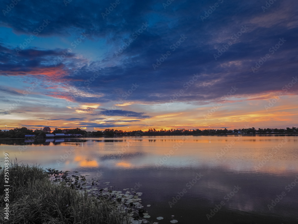 Lake view morning scenic above lotus lake with cloudy sky background, sunrise at Krajub Reservoir, Ban Pong, Ratchaburi, Thailand.