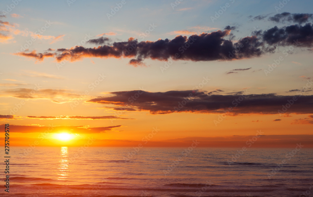 Fototapeta premium Sunset at sea in summer