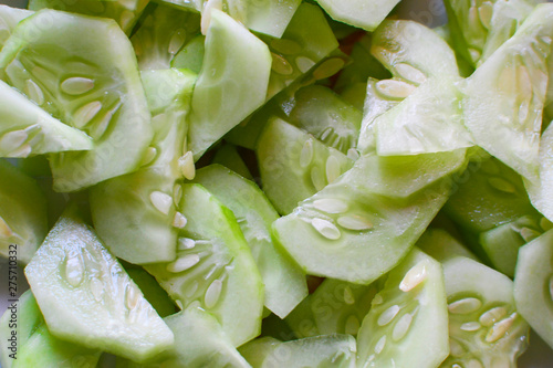 Fresh sliced cucumbers. Slices of fresh cucumber. Abstract natural background.