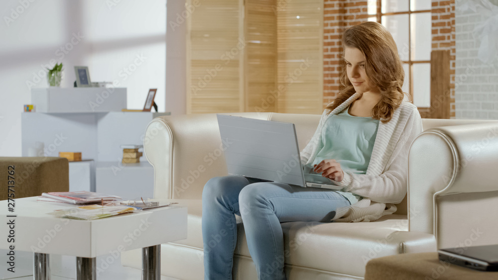 Pretty woman chatting in social networks on laptop, having rest, shopping online Pretty woman chatting in social networks on laptop, having rest, shopping online