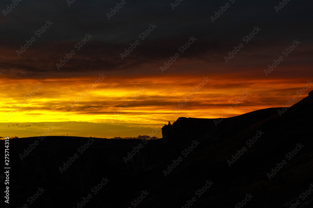 Obraz premium Sunset on the rocks of the river canyon paintings in Santa Cruz, Argentina. 10000 years ago in this place, the native culture painted the famous archaeological site of the 