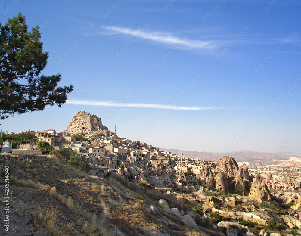 Naklejka premium Panoramic view of natural rock castle of Uchisar - the highest point and famous tourist destination in Cappadocia, Turkey