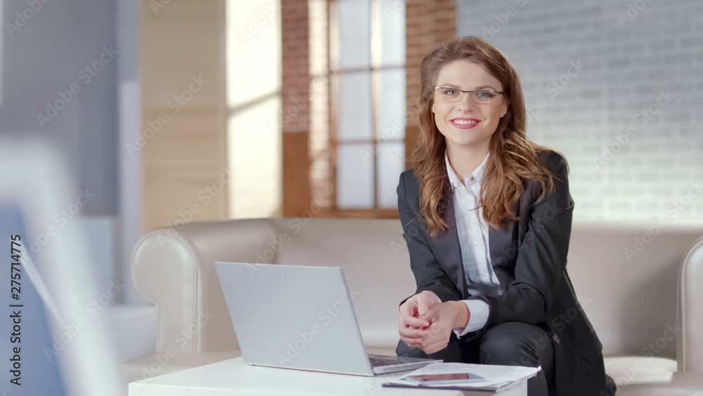 Attractive lady in glasses smiling into camera, smart and responsible employee Attractive lady in glasses smiling into camera, smart and responsible employee