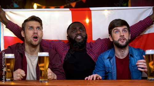 Fotografi English football team losing game, multiracial male football fans disappointed