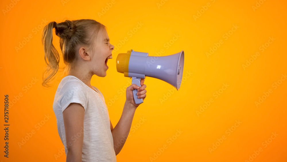 Anxious teen girl shouting in loudspeaker, relieving stress, children rights - obrazy, fototapety, plakaty 