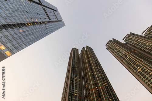 Tall modern towers stretch up into soft dusk sky