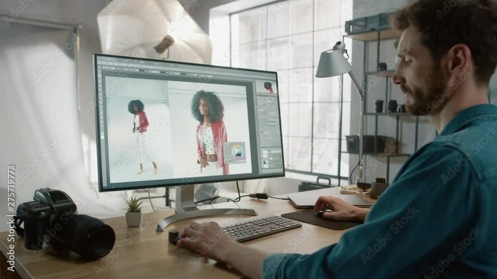 Professional Photographer Sitting at His Desk Uses Desktop Computer in a Photo Studio Retouches. After Photoshoot He Retouches Photographs of Beautiful Black Female Model in an Image Editing Software Professional Photographer Sitting at His Desk Uses Desktop Computer in a Photo Studio Retouches. After Photoshoot He Retouches Photographs of Beautiful Black Female Model in an Image Editing Software
