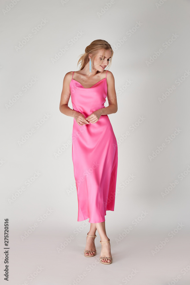 Fototapeta premium Pretty woman beautiful face bright makeup long blond hair fashion model wear trend clothes for date party summer walk travel cruise collection organic silk cotton dress accessory jewelry white studio.