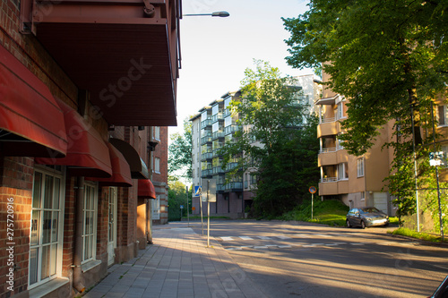 Street in the Finnish city of Turku with a large granite stone between two residential buildings