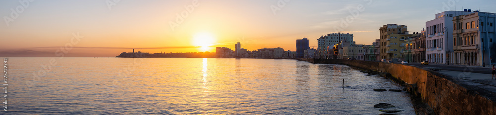 Beautiful Panoramic view of the Old Havana City, Capital of Cuba, during a colorful cloudy sunrise.