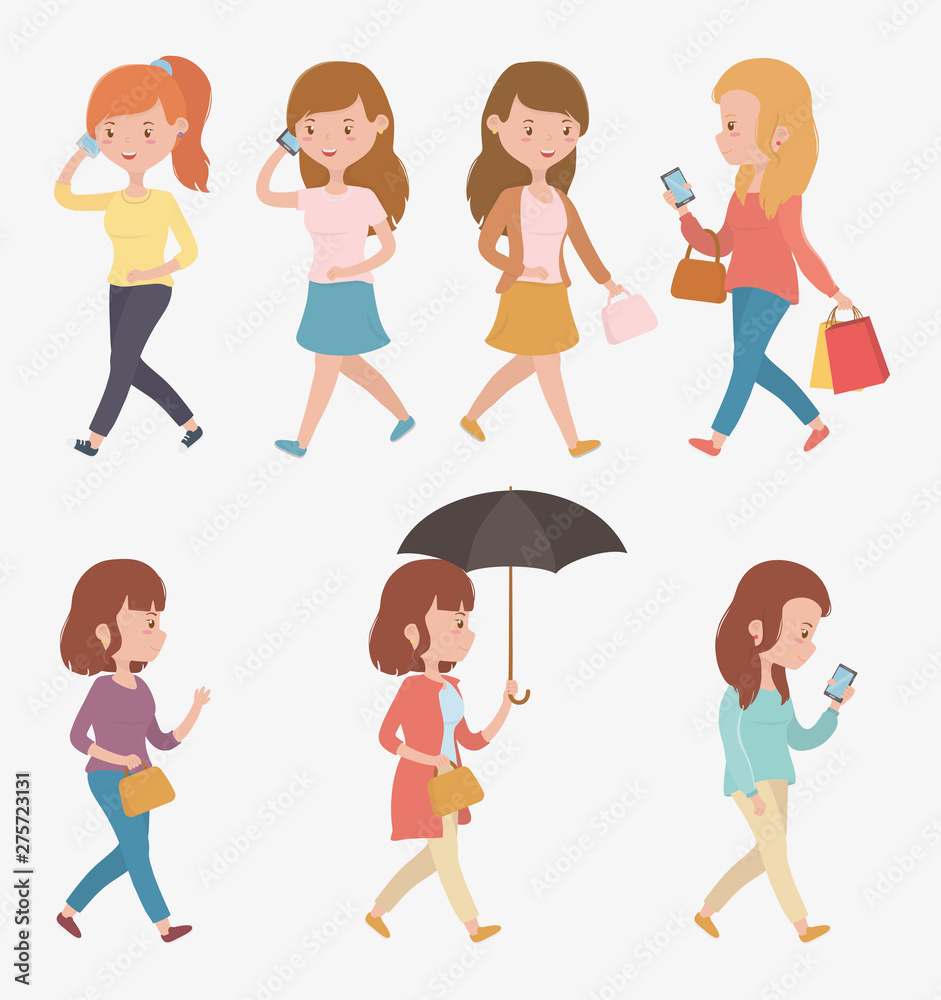 group of beautiful women walking using smartphones group of beautiful women walking using smartphones