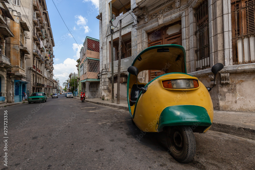 Residential Street view of the Old Havana City, Capital of Cuba, during a bright and sunny day.