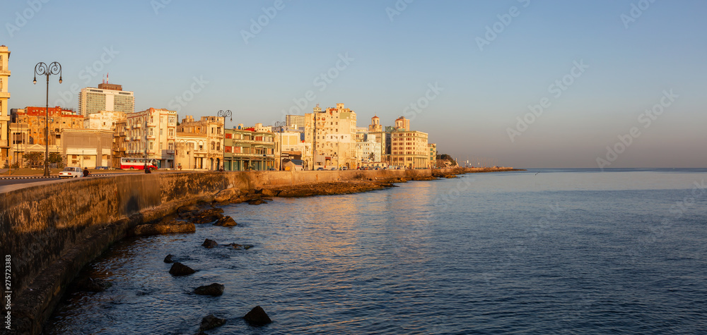 Beautiful panoramic view of the Old Havana City, Capital of Cuba, by the Ocean Coast during a vibrant sunny sunrise.