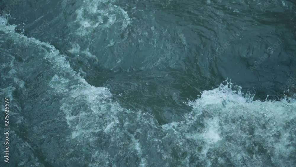 Mountain river water with fast closeup. Water beats on the stones. The rapid flow of the river on 4k video. Mountain river water with fast closeup. Water beats on the stones. The rapid flow of the river on 4k video.