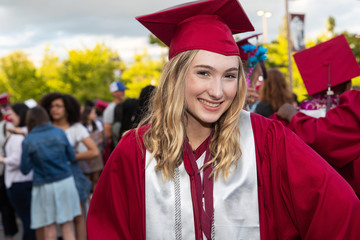 Happy high school student celebrates graduation