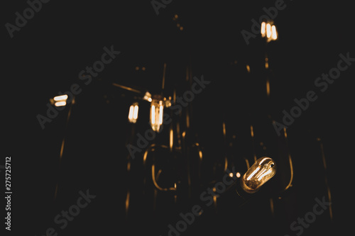 Dim vintage lightbulbs glow...