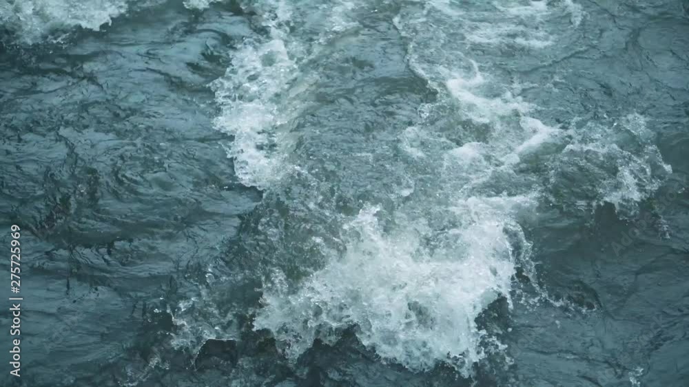 Mountain river water with fast closeup. Water beats on the stones. The rapid flow of the river on 4k video. Mountain river water with fast closeup. Water beats on the stones. The rapid flow of the river on 4k video.