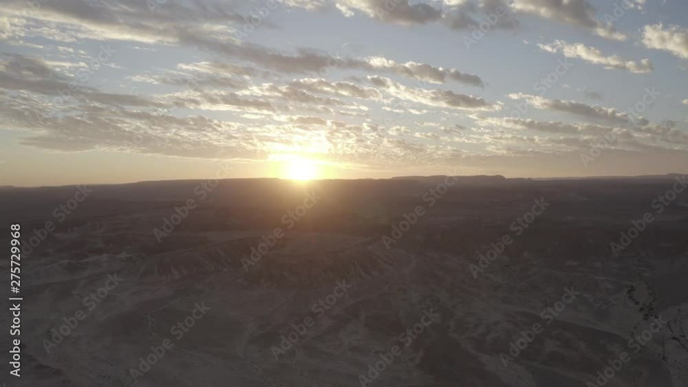 Drone flies over the barren moon landscape of the Israeli desert Negev. Time lapse of the beautiful sunset in the red desert Drone flies over the barren moon landscape of the Israeli desert Negev. Time lapse of the beautiful sunset in the red desert