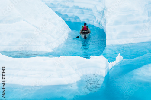 On top of a glacier is a dangerous place to paddle a canoe, but also a beautiful place to see from a new angle.