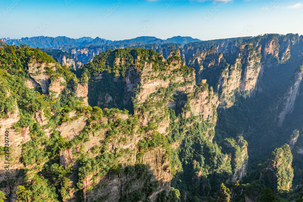 Colorful cliffs in Zhangjiajie Forest Park at sunny evening time.
