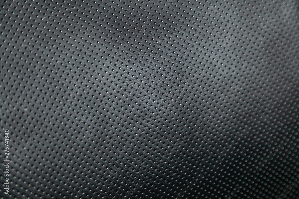 Close-up black car seat trim. Soft rough carbon fabric texture. Close-up black car seat trim. Soft rough carbon fabric texture.