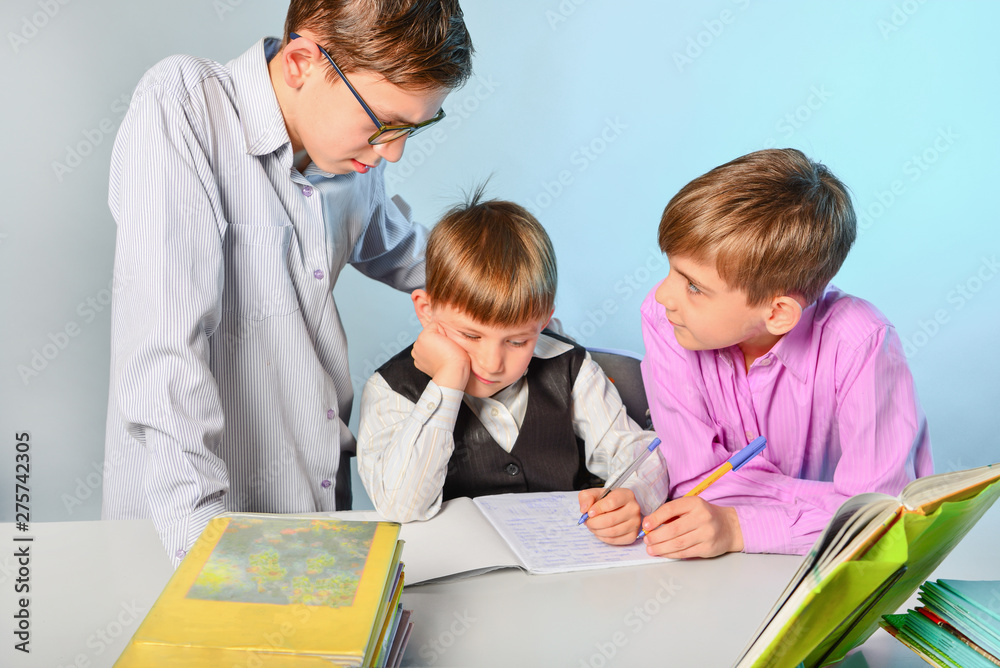 Fototapeta premium Children do their homework, solve problems and get ready for school.