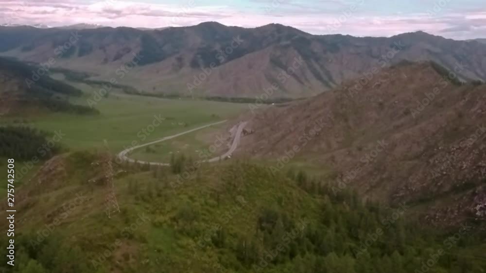 flight over road through Mountain pass. mountain valley in Russia, Altay flight over road through Mountain pass. mountain valley in Russia, Altay