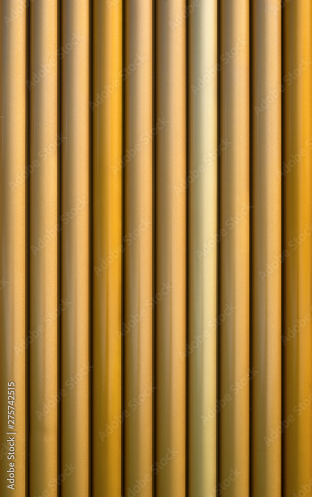 Fototapeta premium Golden glossy pipe lines background.