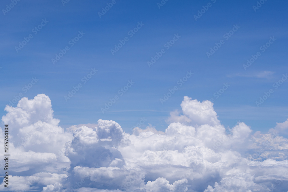 Beautiful scenery of sky and white clouds looking from window on airplane. Space for text Beautiful scenery of sky and white clouds looking from window on airplane. Space for text